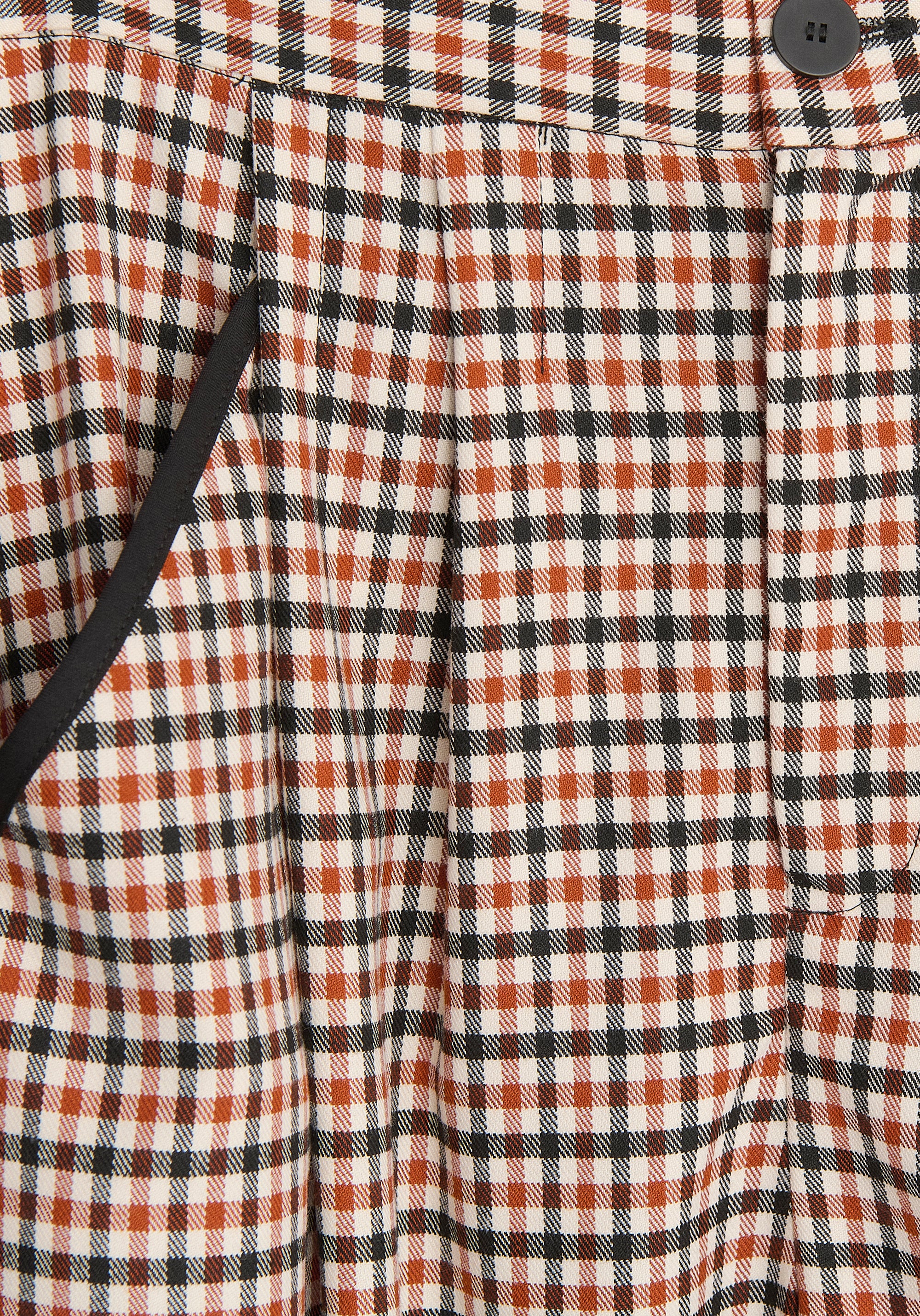 Check Trousers with Piping Details in Red, White and Black Close Up