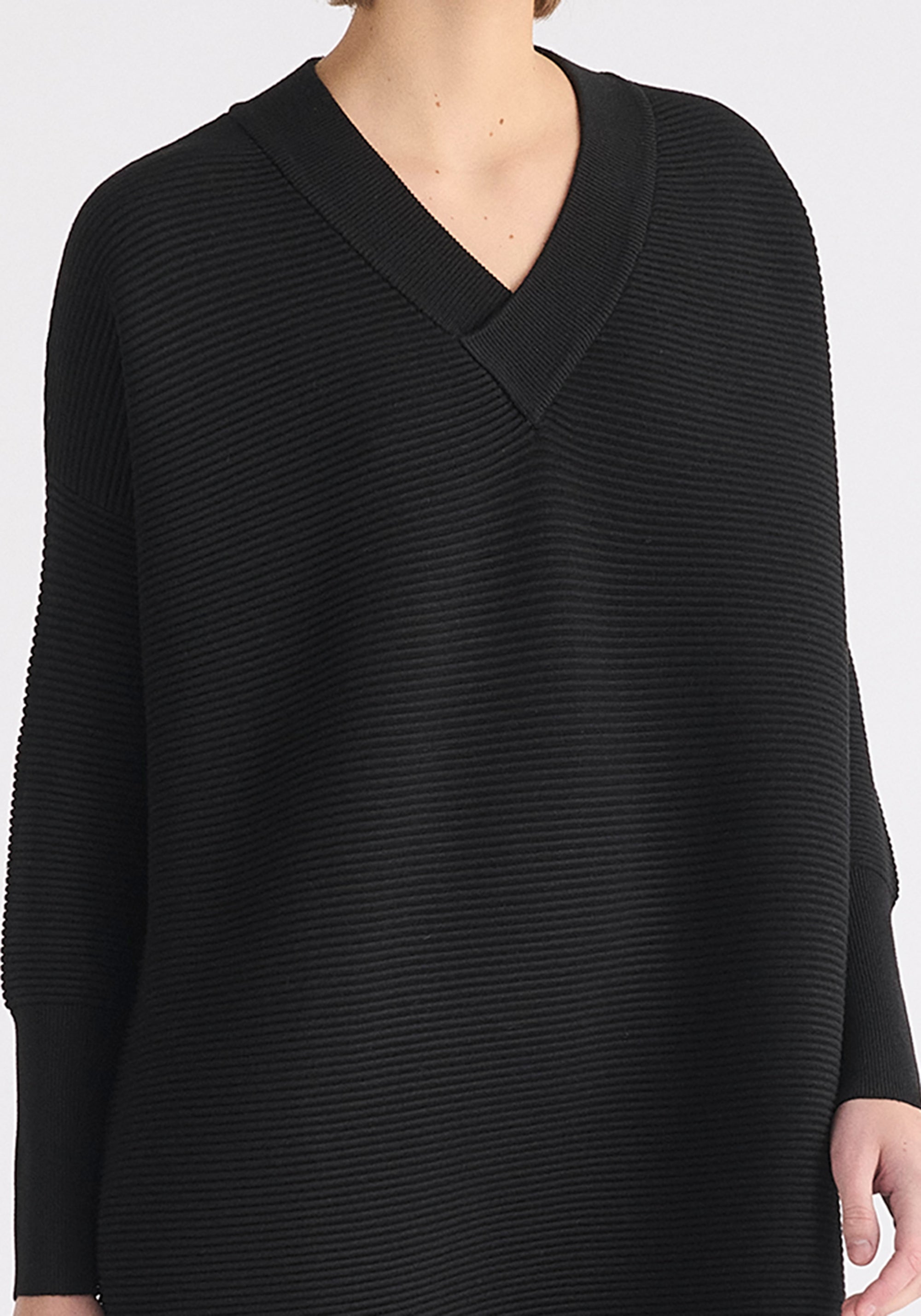 Paisie V-Neck Ribbed Jumper Dress in Black Close Up