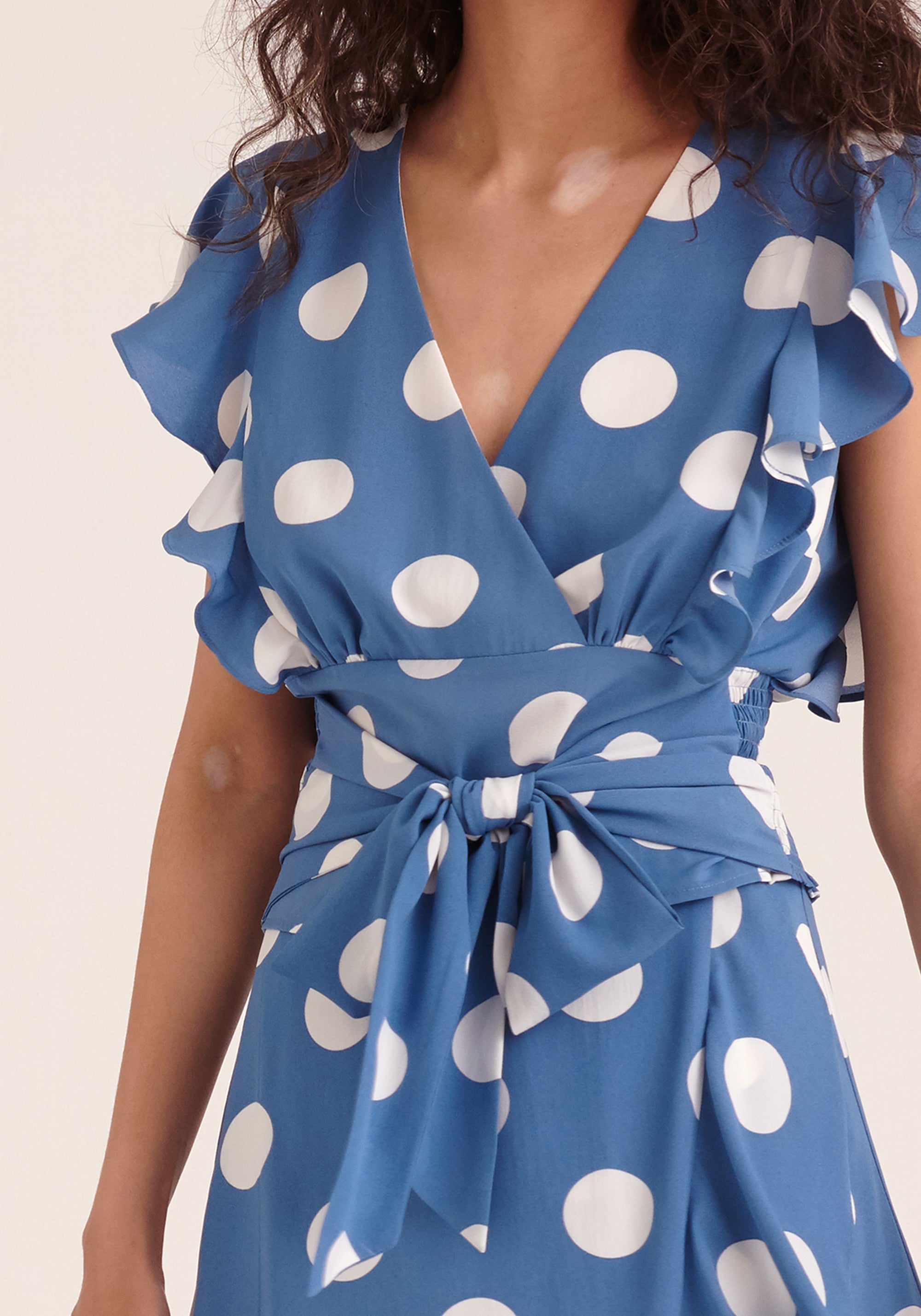 Paisie Polka Dot Wrap Tie Top in Blue and White Close Up