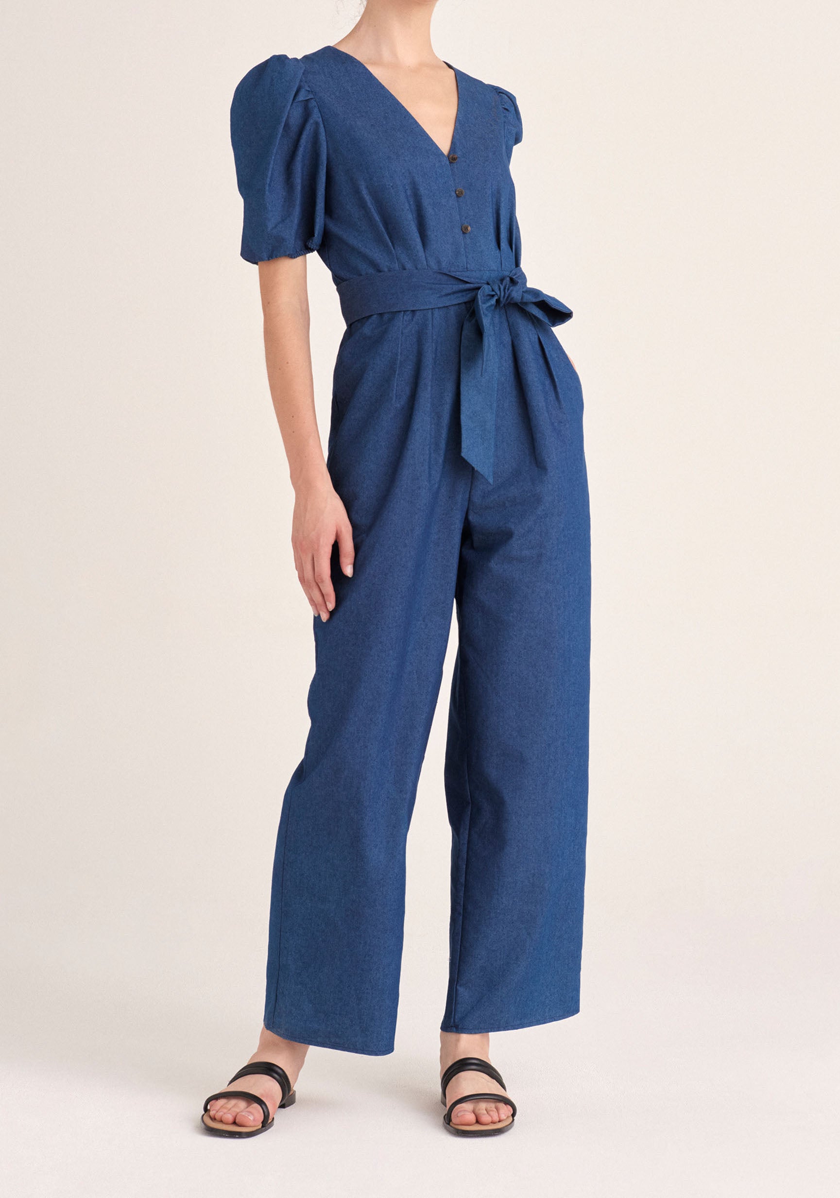 Paisie Puff Sleeve Denim Jumpsuit with Belt in Blue