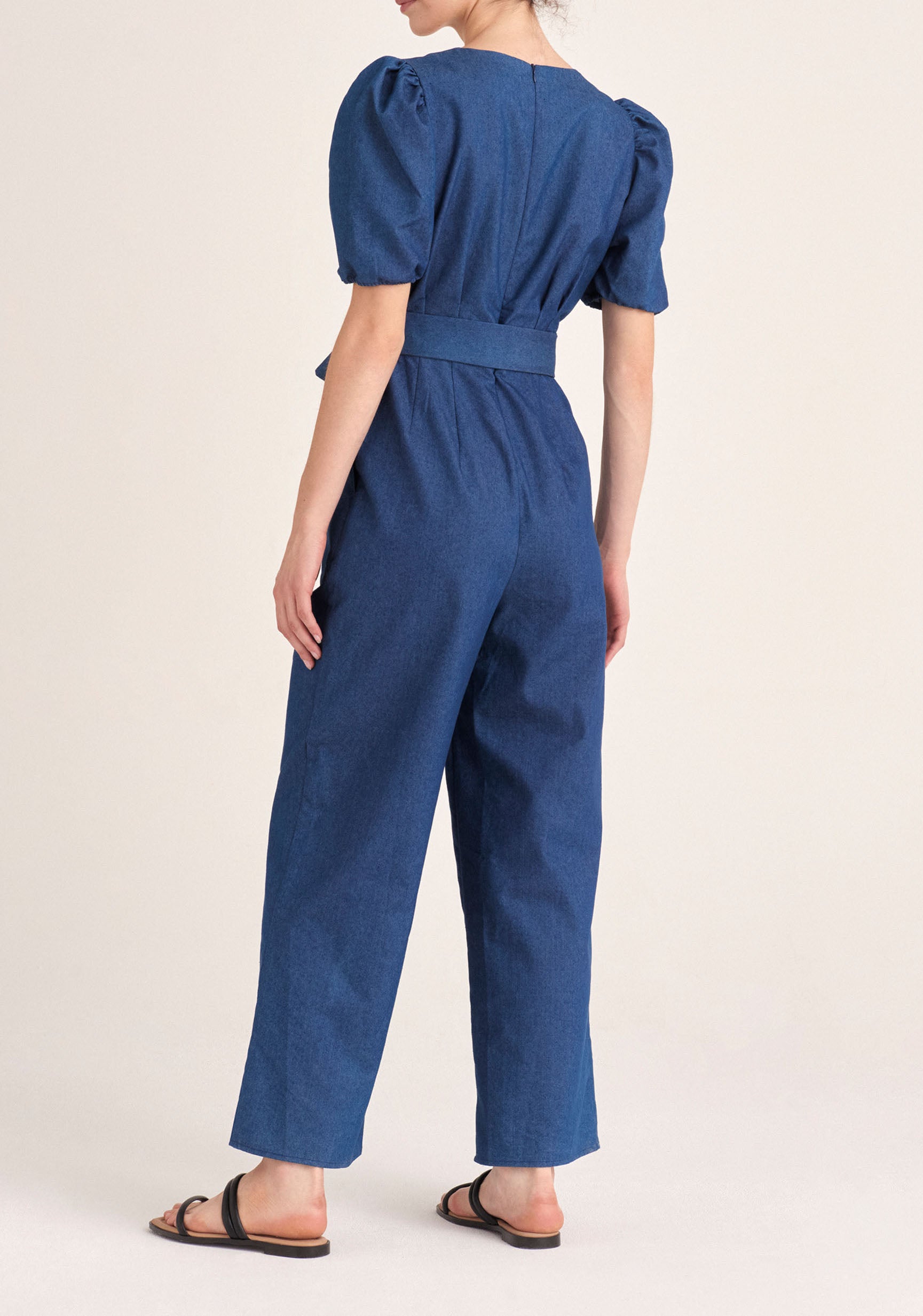 Paisie Puff Sleeve Denim Jumpsuit with Belt in Blue Back