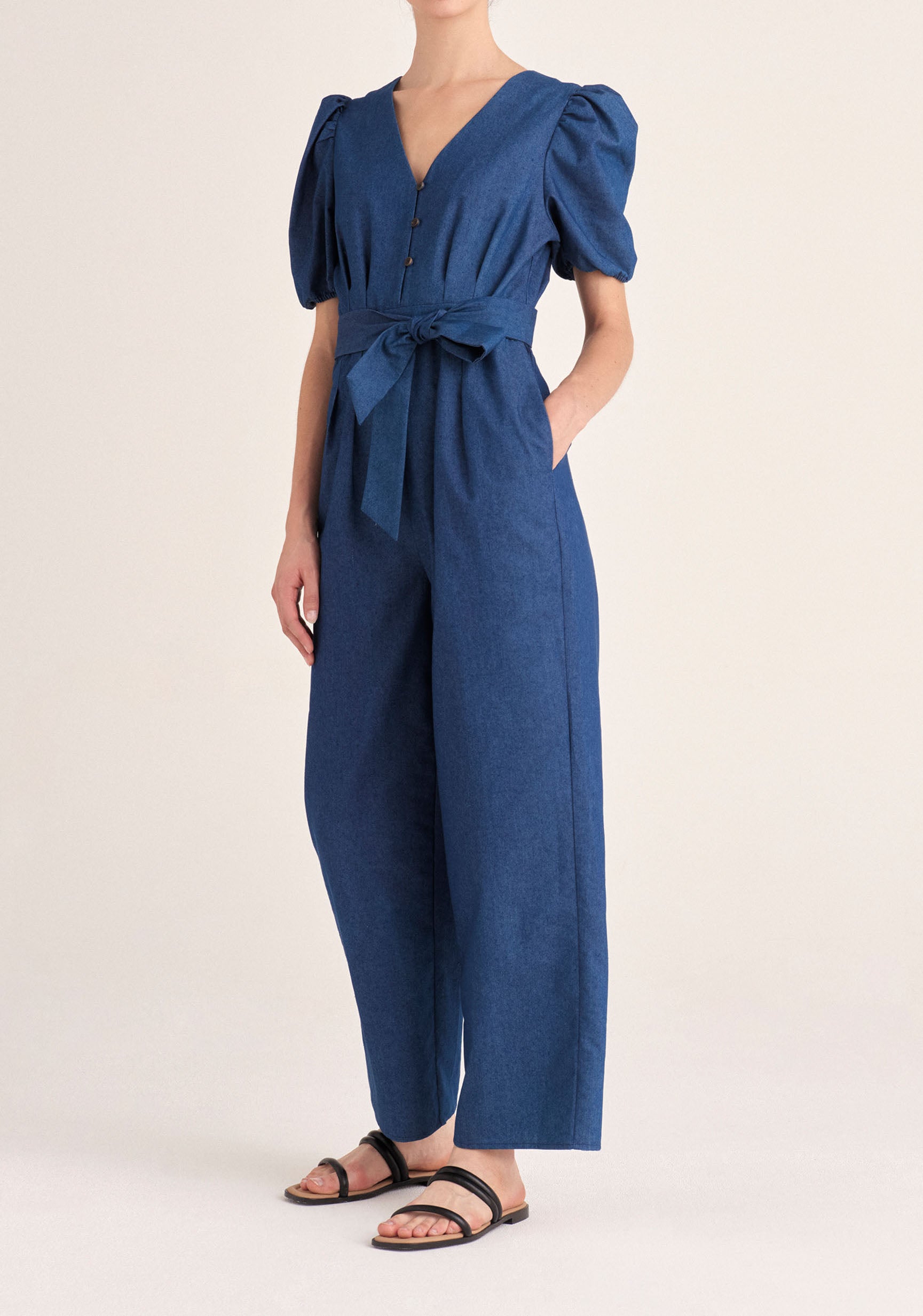 Paisie Puff Sleeve Denim Jumpsuit with Belt in Blue