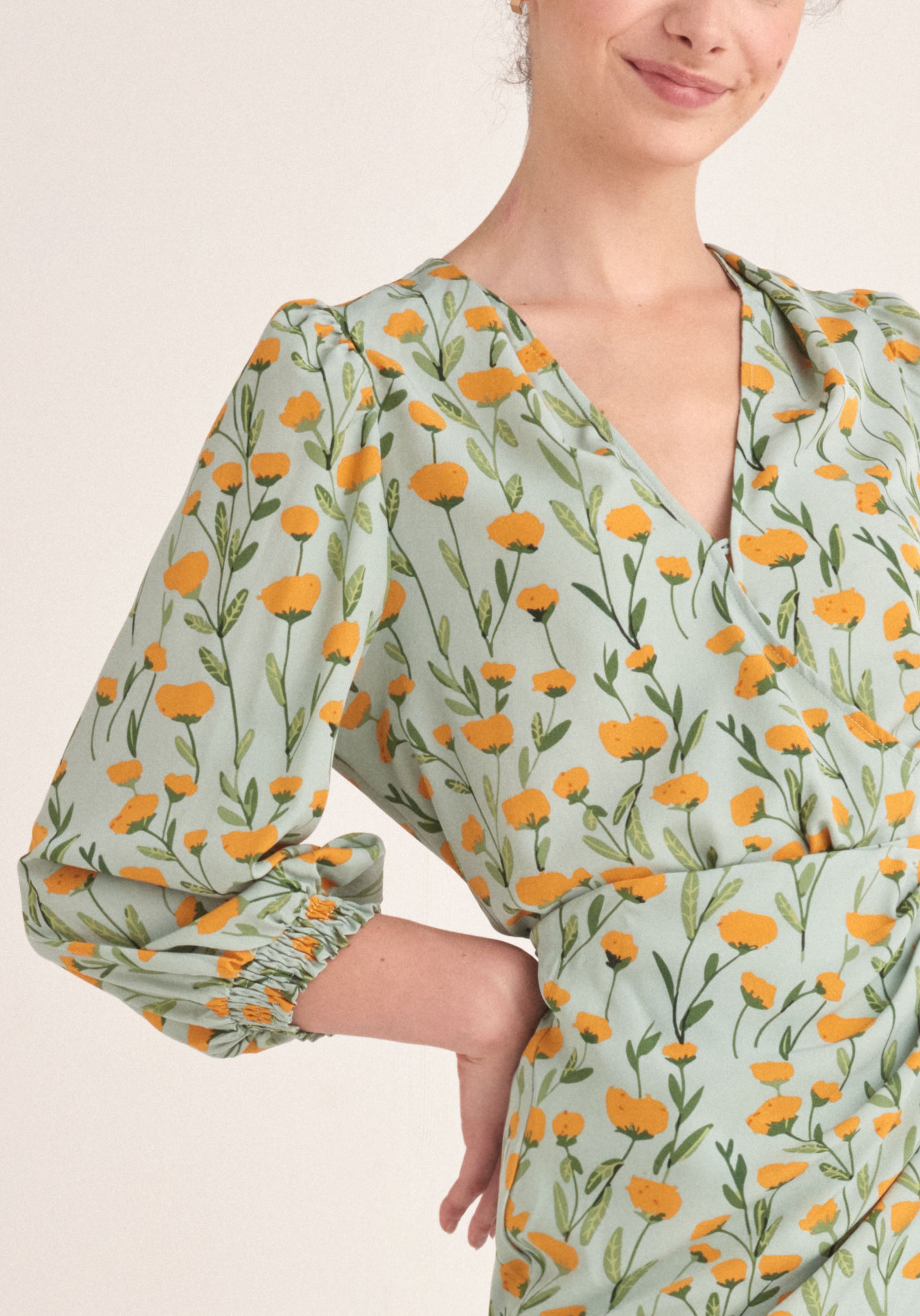 Paisie Floral Balloon Sleeve Wrap Top in Green Close Up