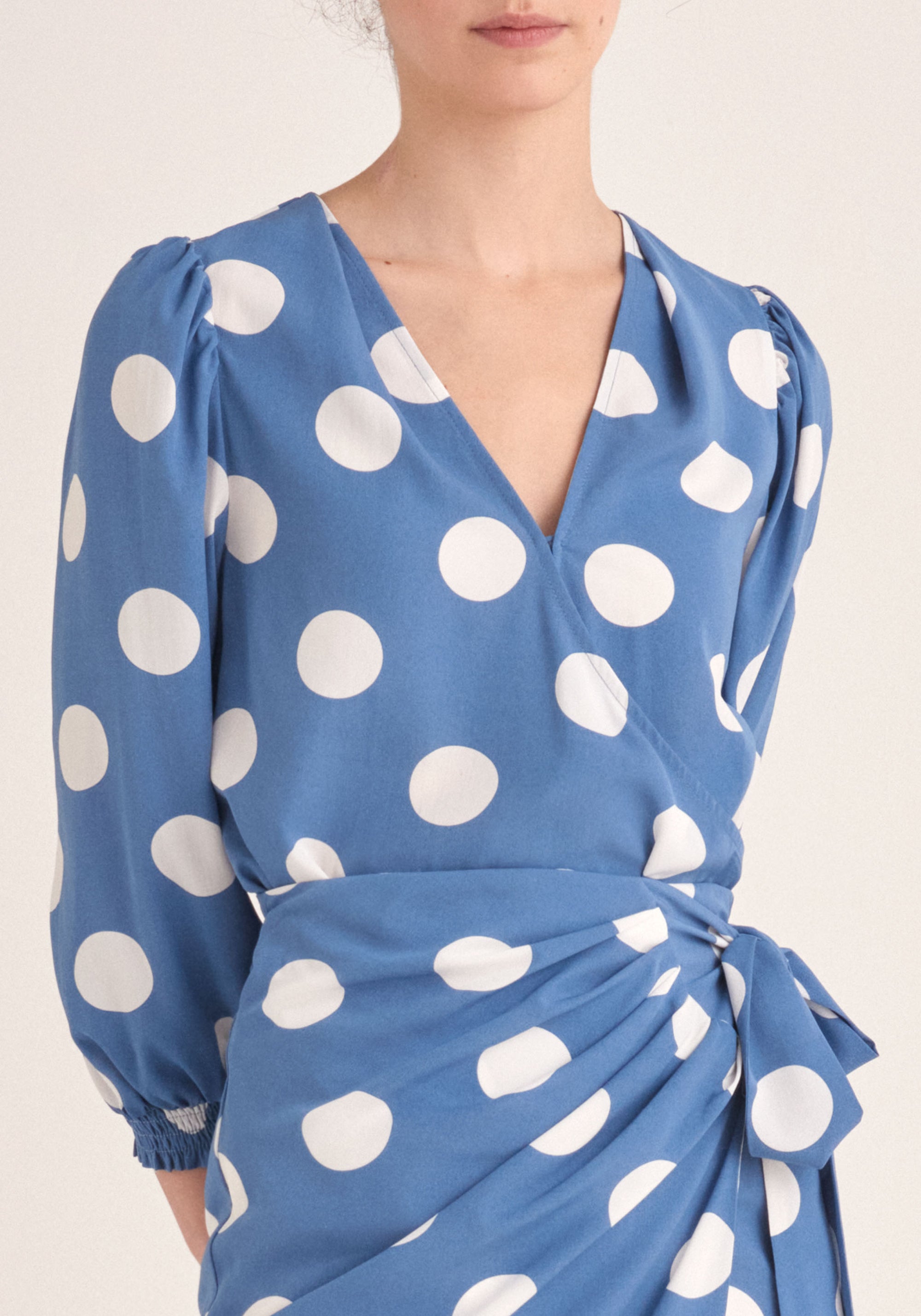 Paisie Polka Dot Balloon Sleeve Wrap Top in Blue and White Close Up