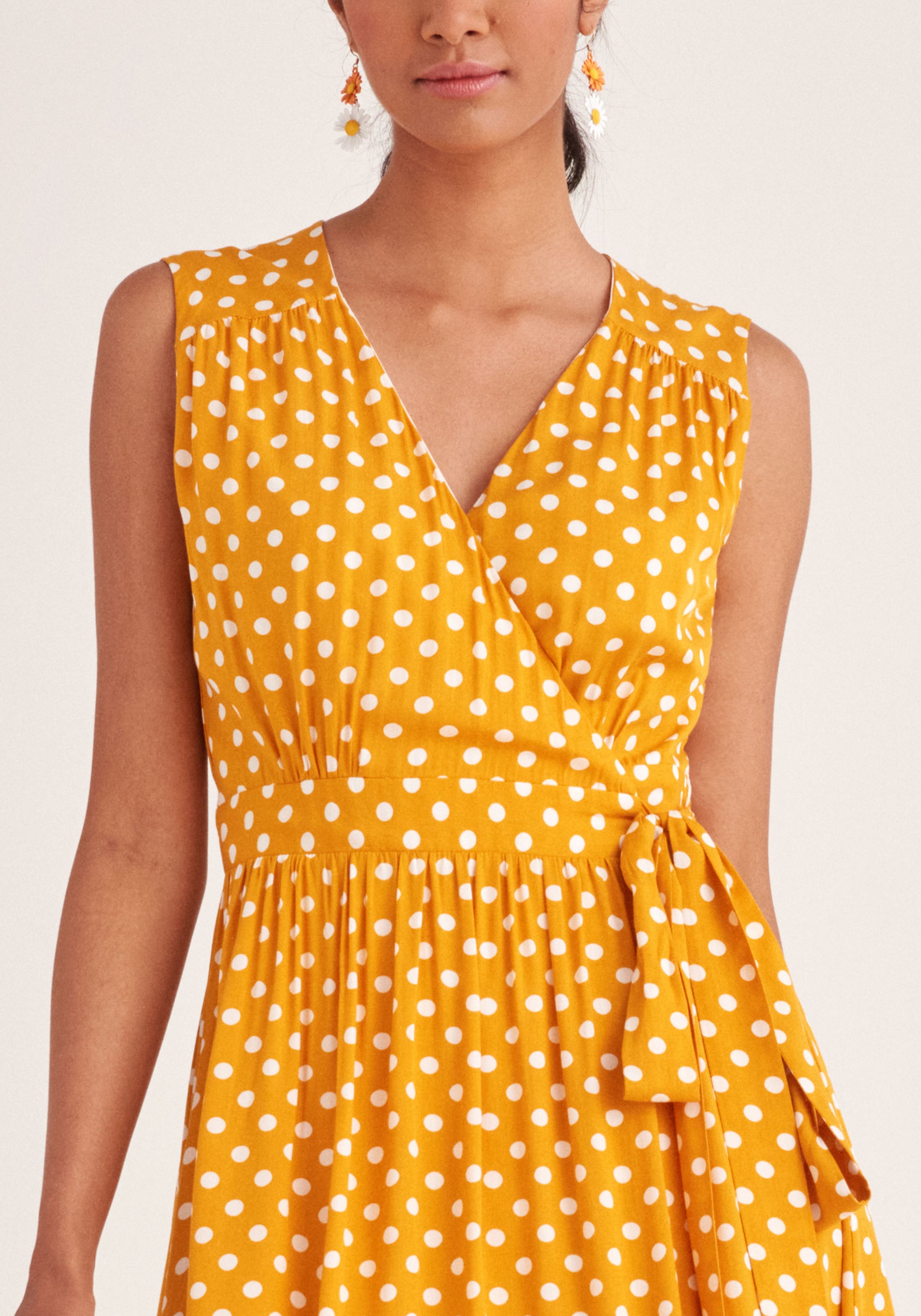 Paisie Sleeveless Polka Dot Wrap Dress in Yellow and White Close Up