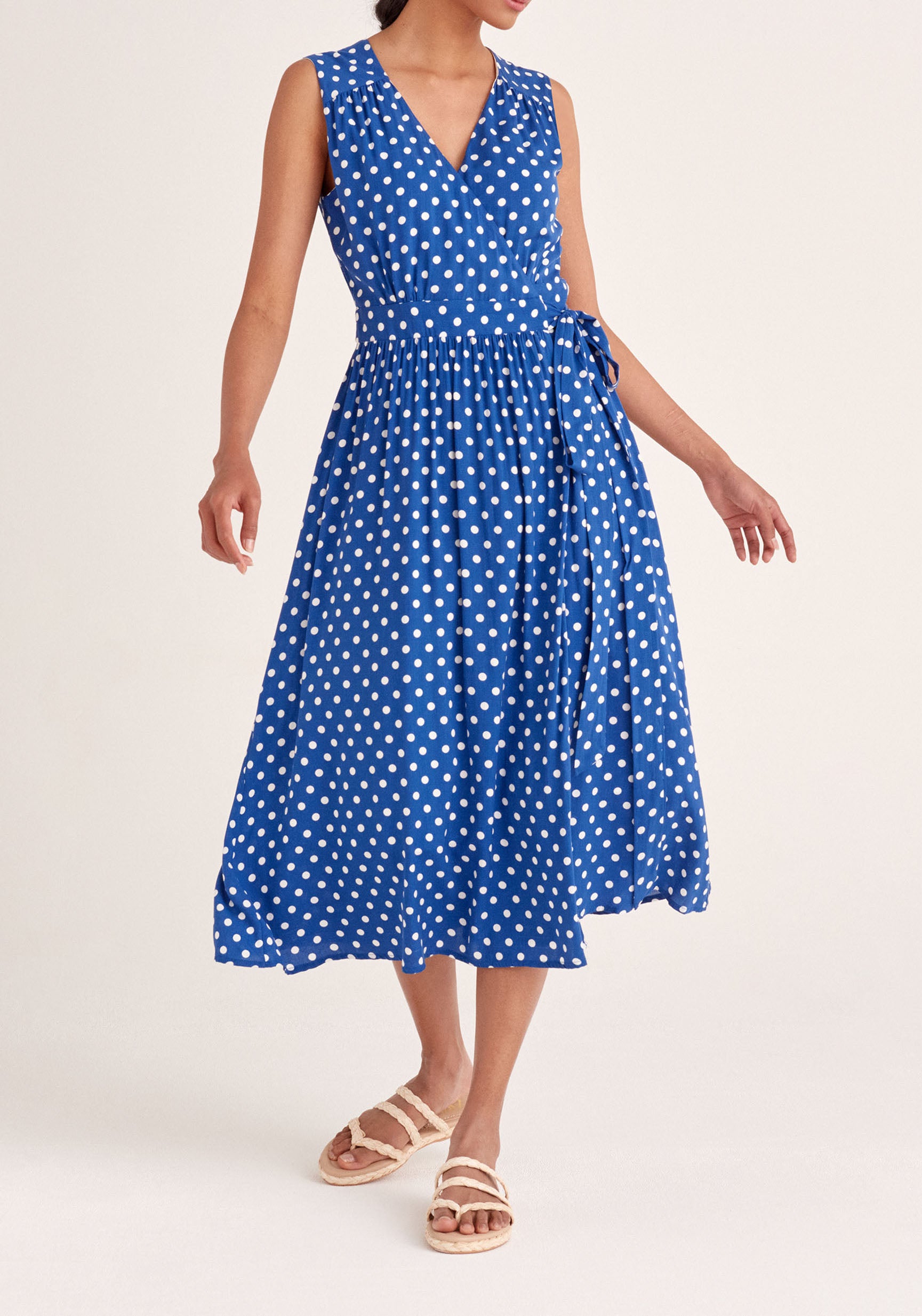 Paisie Sleeveless Polka Dot Wrap Dress in Dark Blue and White