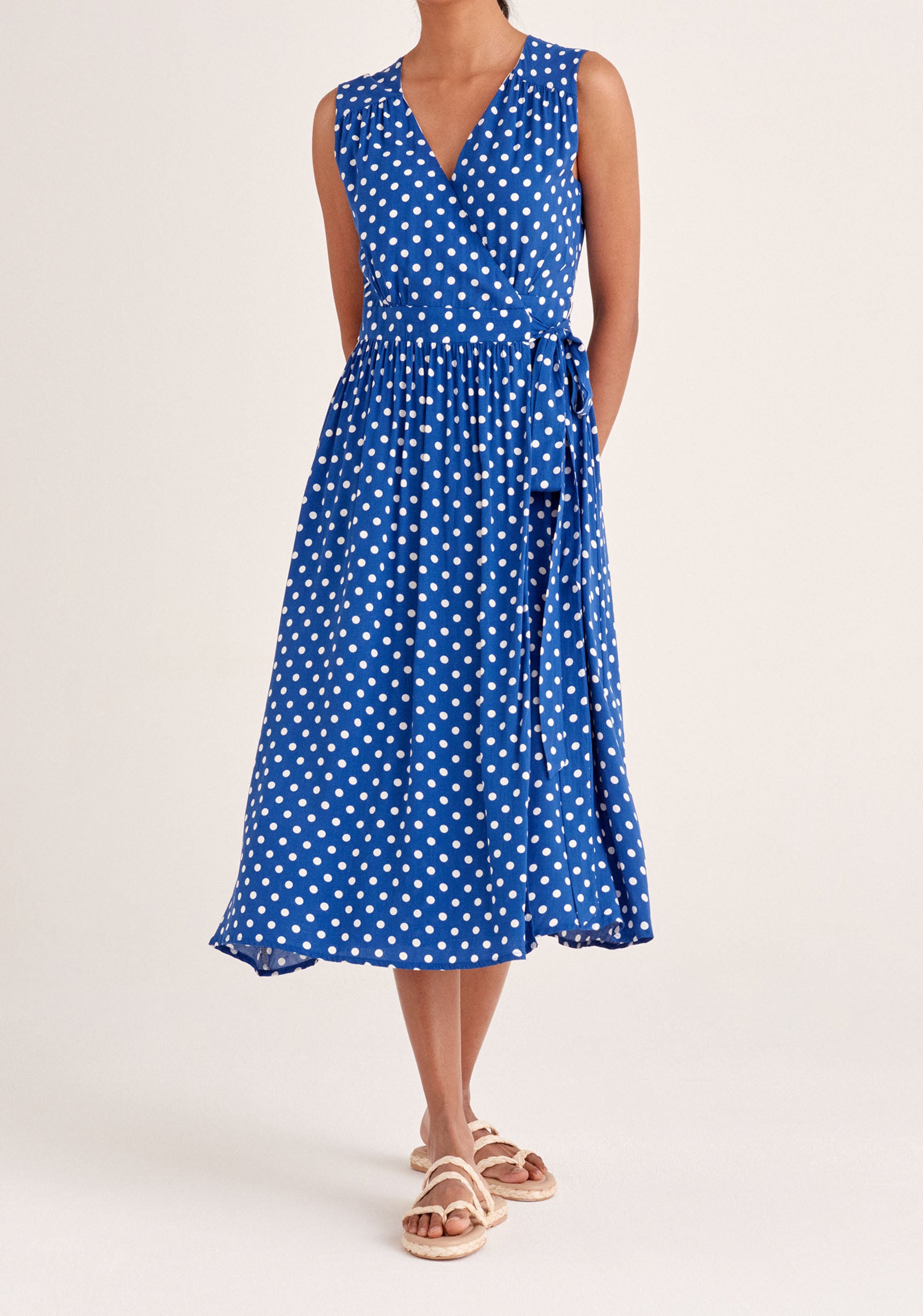 Paisie Sleeveless Polka Dot Wrap Dress in Dark Blue and White